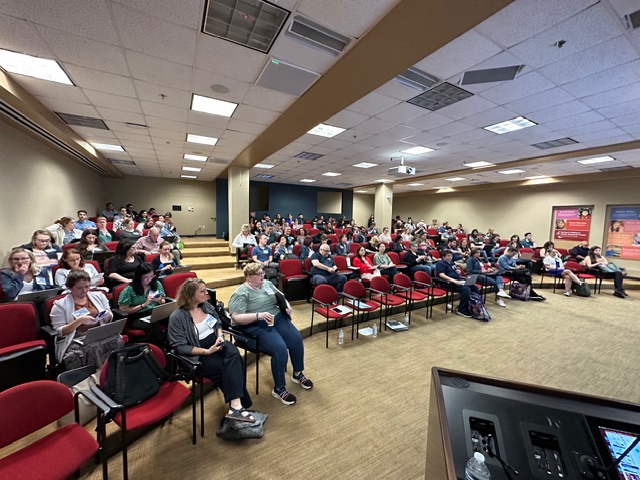 Full auditorium of students attending a lecture at Sanford Burnham Prebys